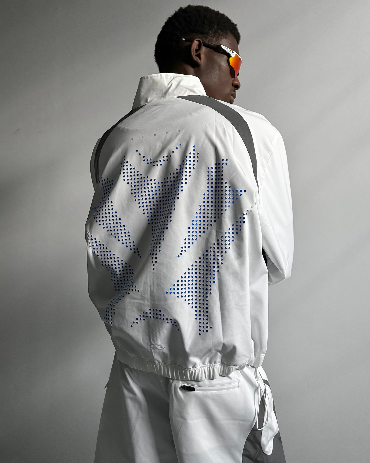 011. PERF Shell Jacket - Titanium White